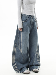 Deconstructed Triple‑Stripe Wide‑Leg Jeans