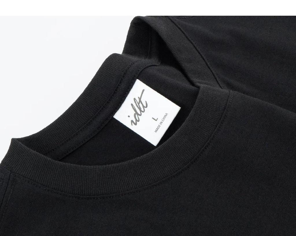 IDLT long sleeve T-shirt, black neckline and label.