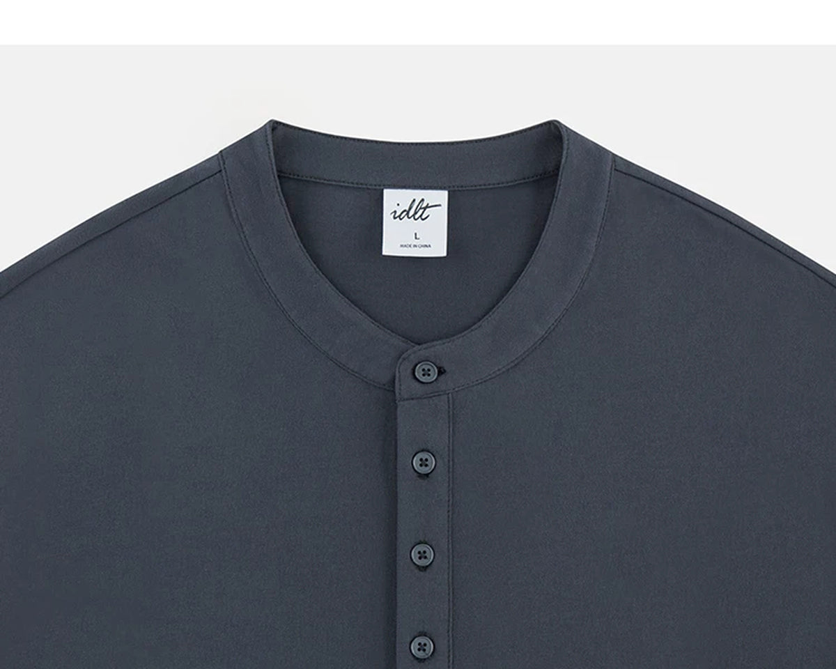 IDLT long sleeve henley, dark gray neckline and buttons.