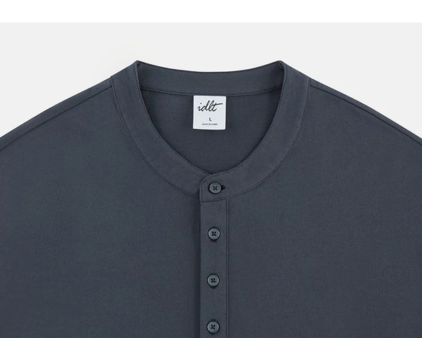 IDLT long sleeve henley, dark gray neckline and buttons.