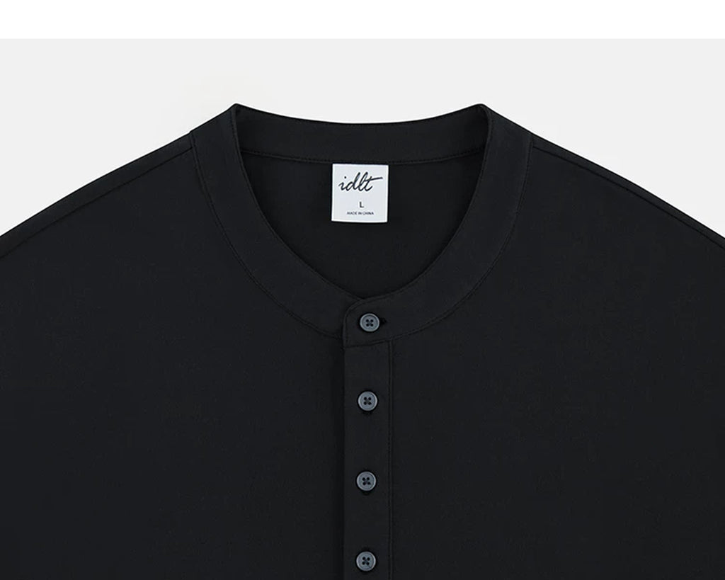 IDLT long sleeve henley, black neckline and buttons.