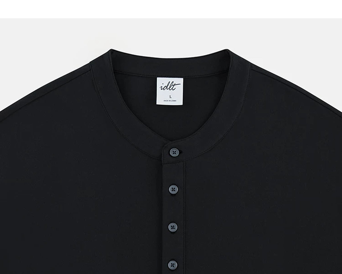 IDLT long sleeve henley, black neckline and buttons.