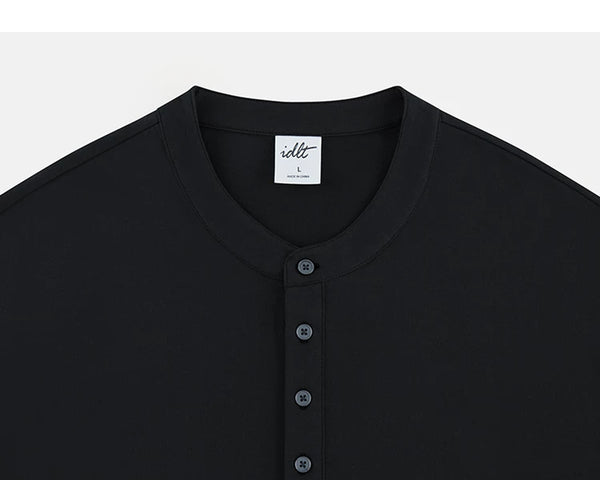 IDLT long sleeve henley, black neckline and buttons.