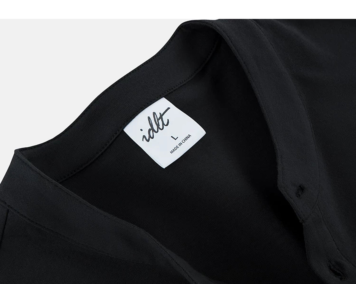 IDLT long sleeve henley, black neckline and label.