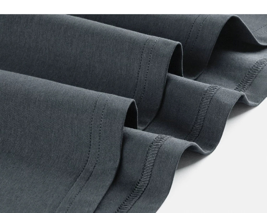 IDLT T-shirt, dark gray hem stitching close-up.