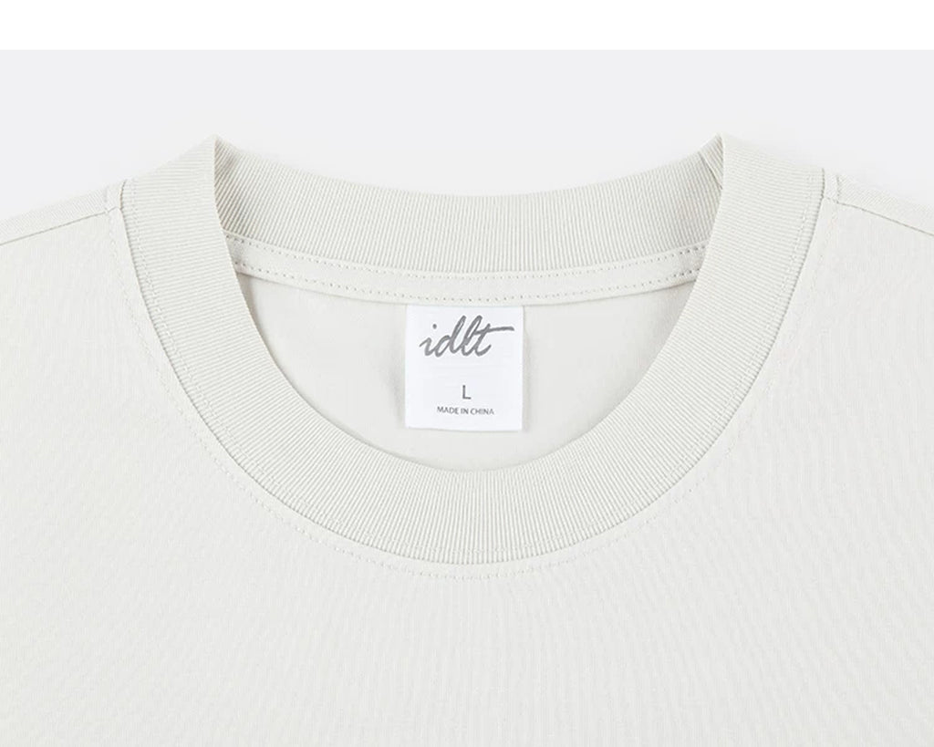 IDLT T-shirt, cream crewneck.