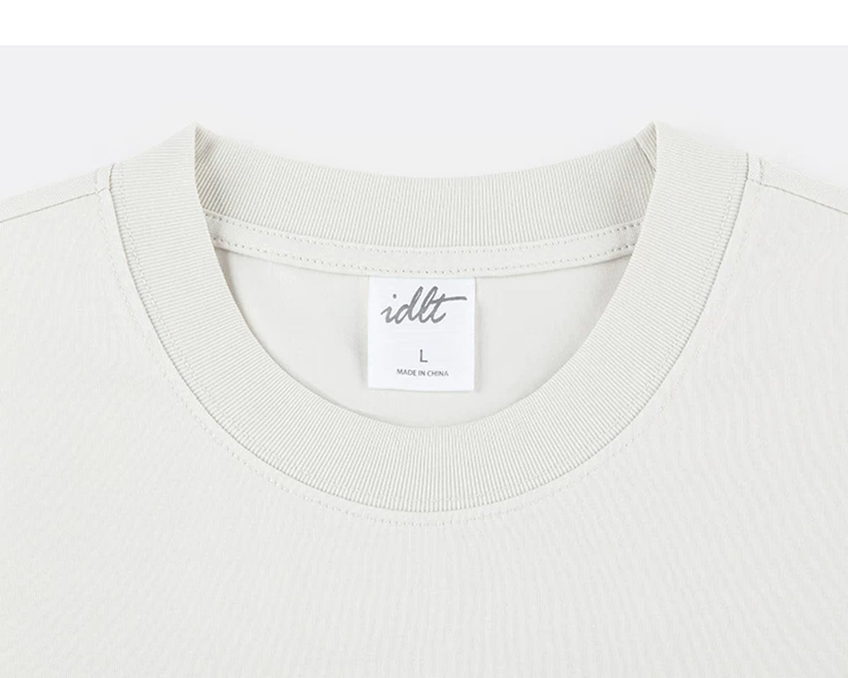 IDLT T-shirt, cream crewneck.