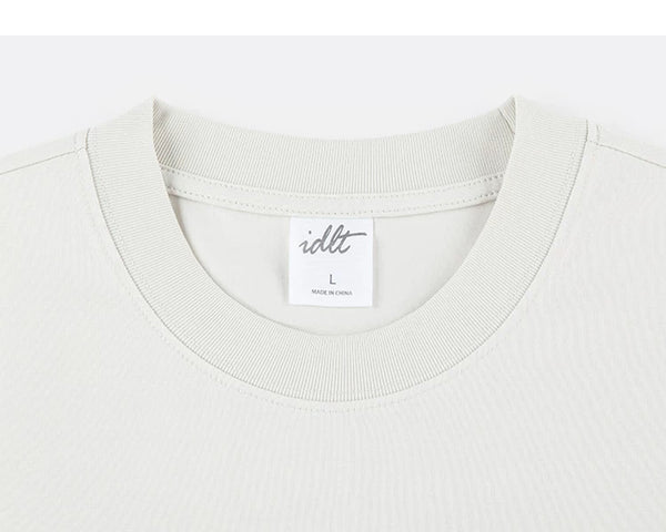 IDLT T-shirt, cream crewneck.