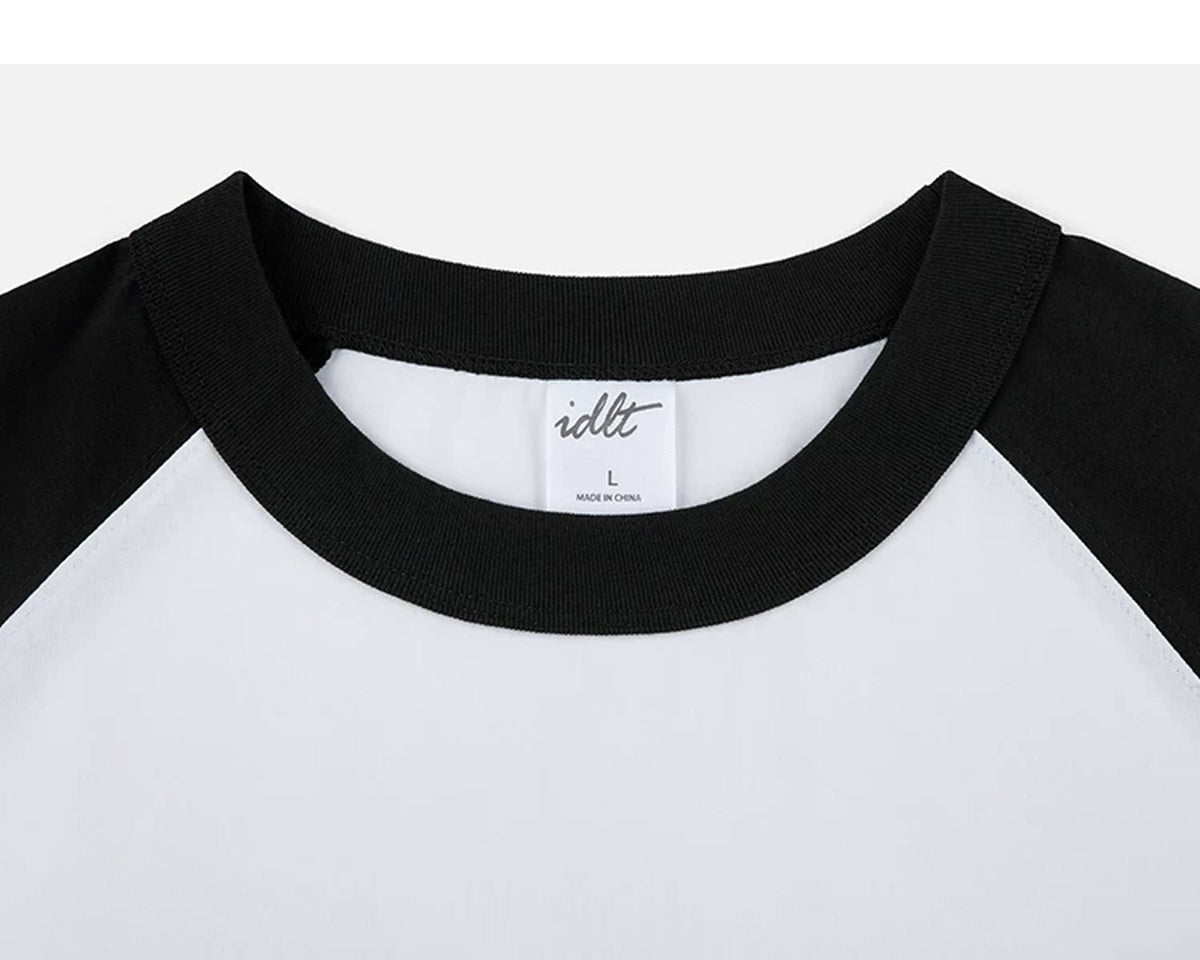 IDLT raglan T-shirt, black and white crewneck.