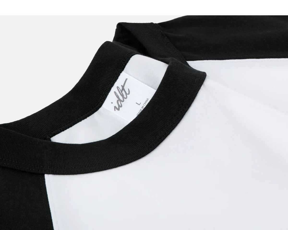 IDLT raglan T-shirt, black and white neckline stitching.