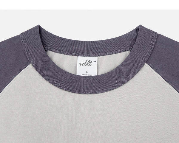 IDLT raglan T-shirt, purple and beige crewneck.
