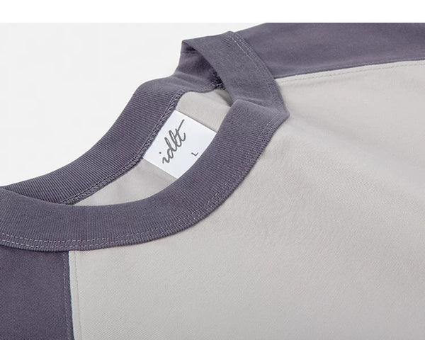 IDLT raglan T-shirt, purple and beige neckline stitching.