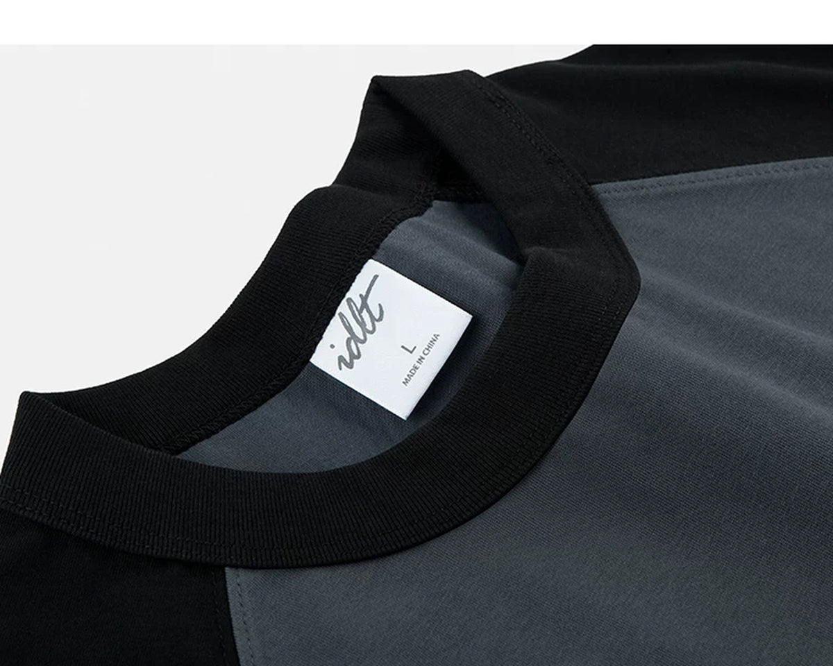 IDLT raglan T-shirt, black and dark gray neckline stitching.