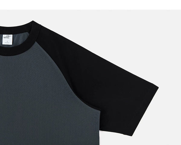 IDLT raglan T-shirt, black sleeve and gray body.
