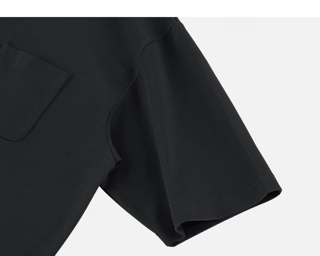 IDLT polo shirt, black sleeve.