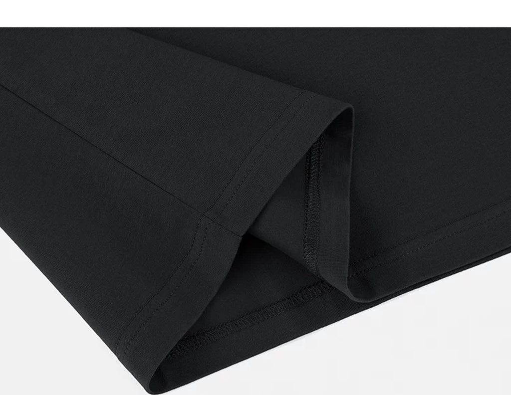 IDLT polo shirt, black folded hem.