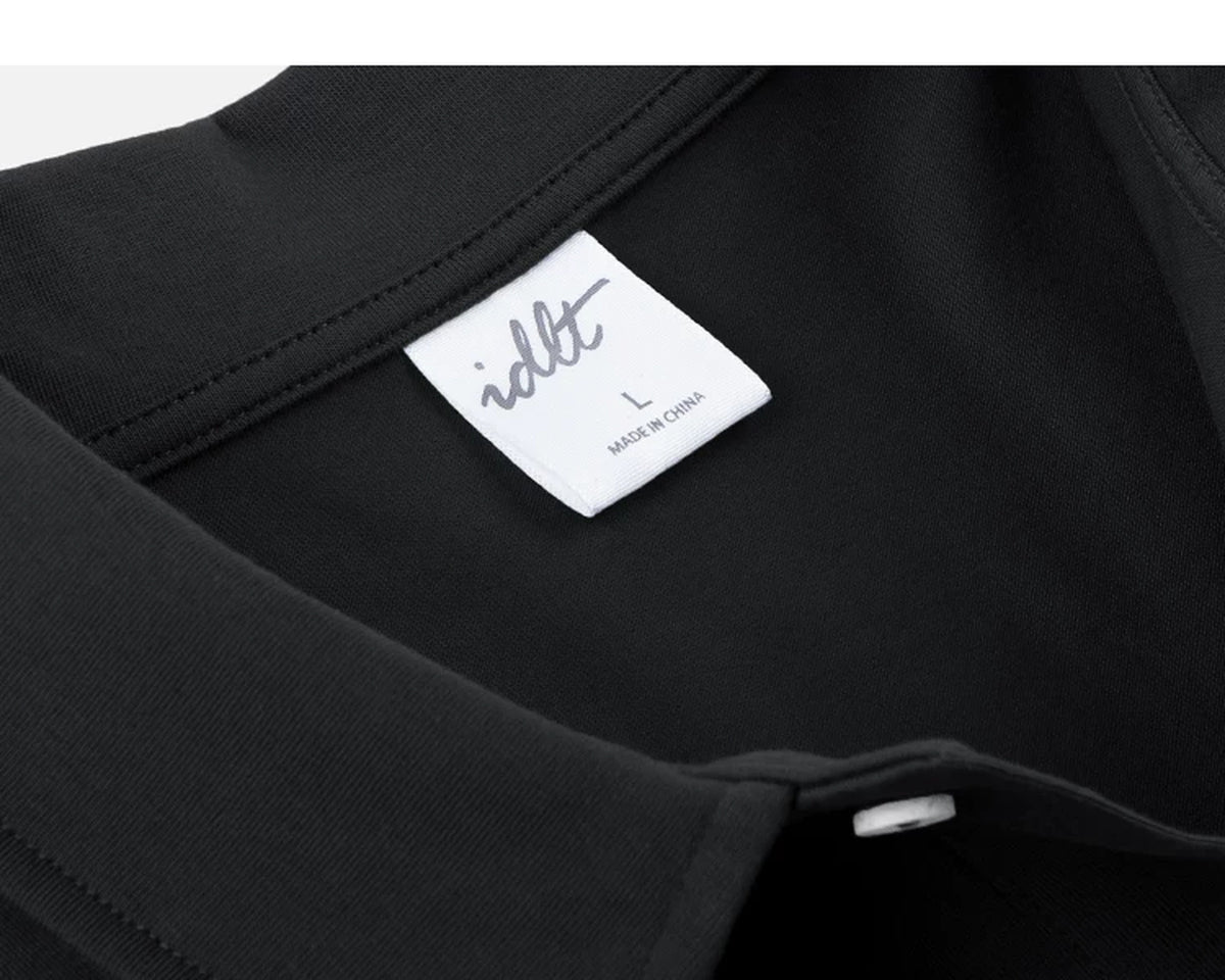 IDLT polo shirt, black neckline label.