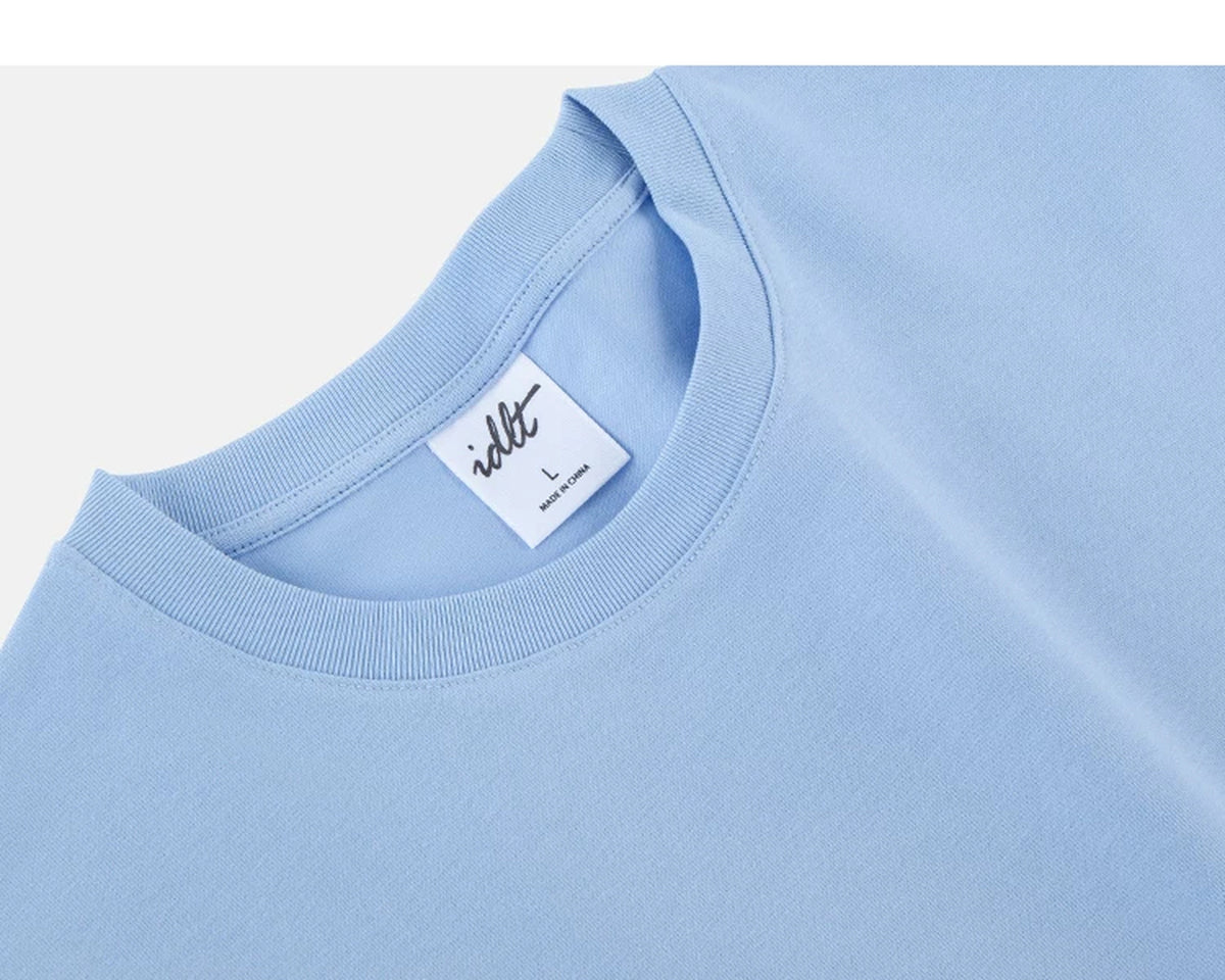 IDLT T-shirt, light blue neckline label.
