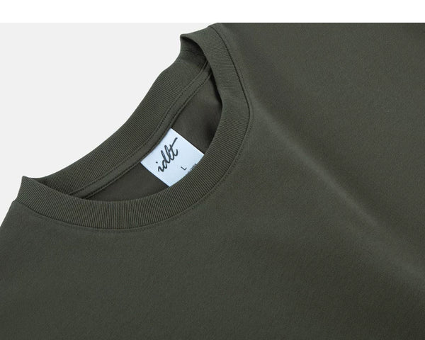 IDLT T-shirt, olive neckline label.