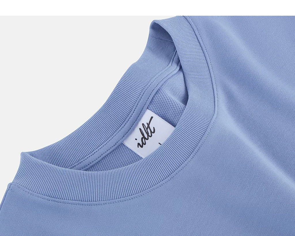 IDLT T-shirt, blue neckline label.