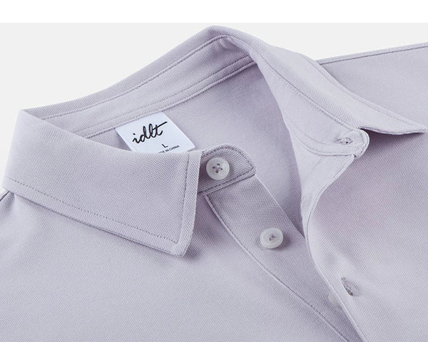 IDLT polo shirt, lavender collar and buttons.