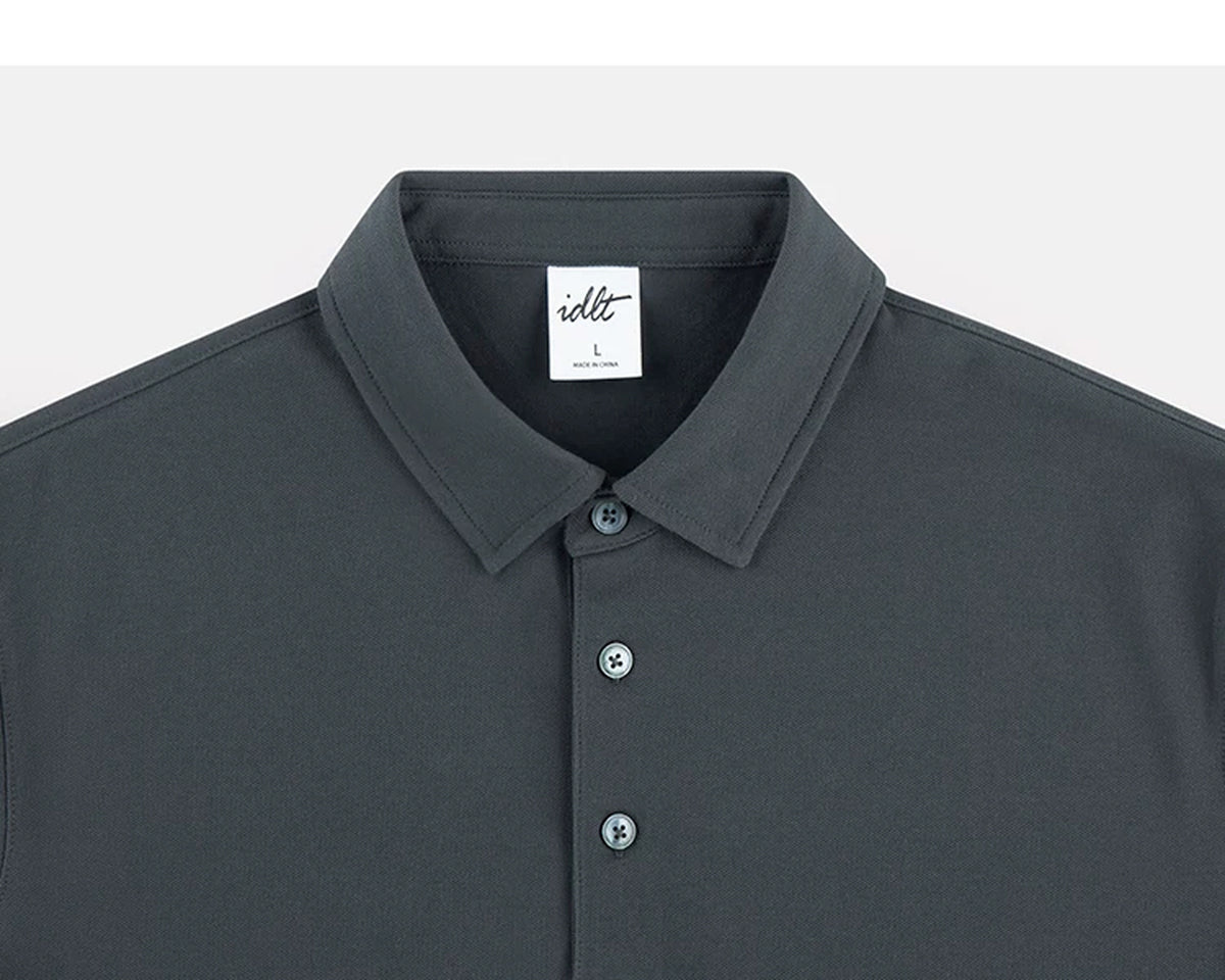 IDLT polo shirt, dark gray collar and placket.