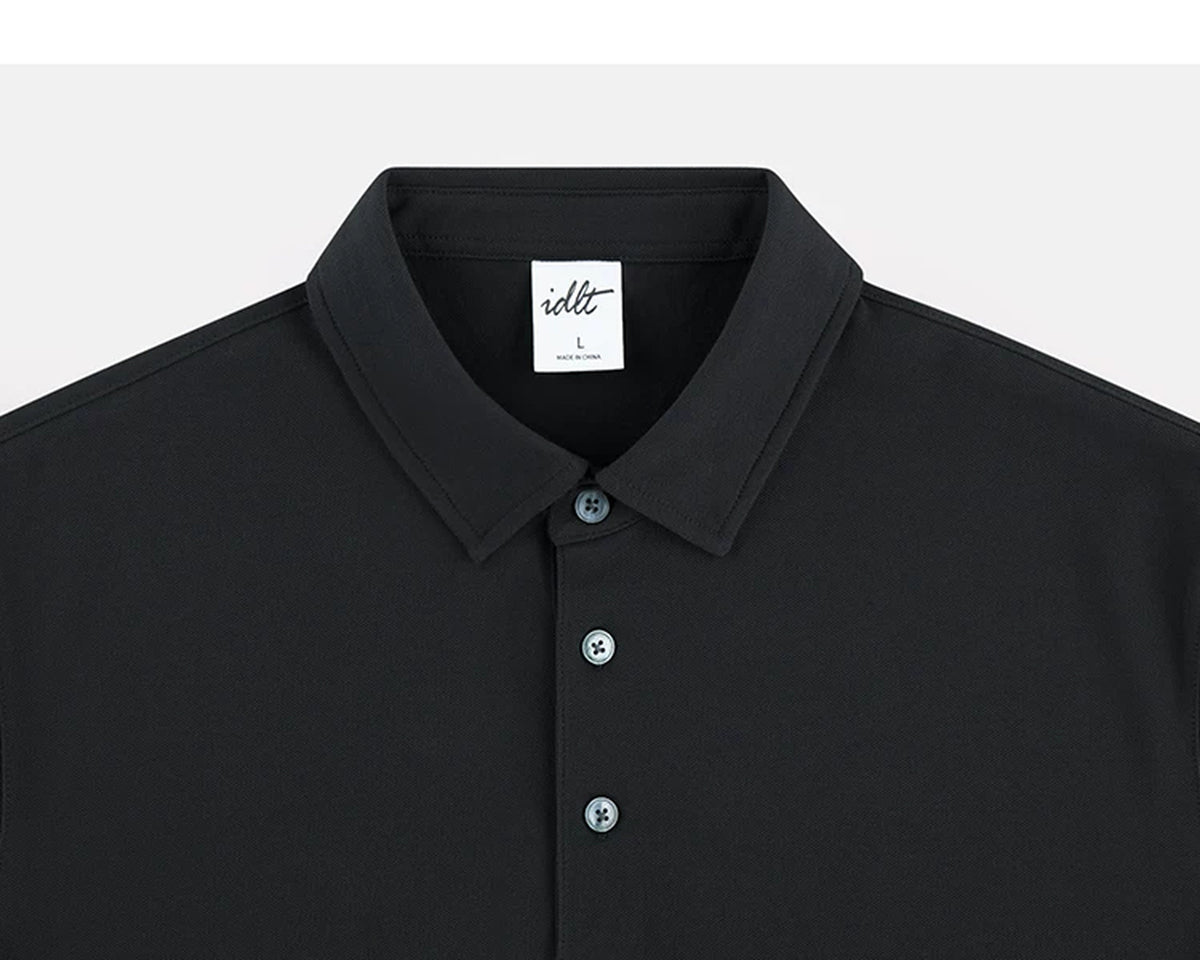 IDLT polo shirt, black collar and placket.