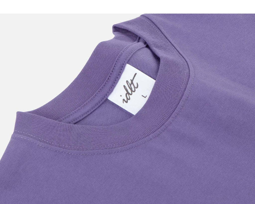 IDLT T-shirt, purple neckline label.