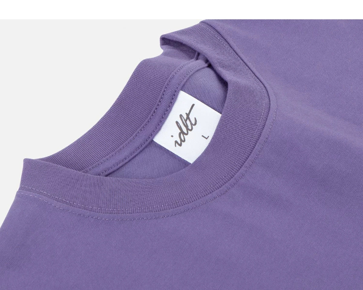IDLT T-shirt, purple neckline label.