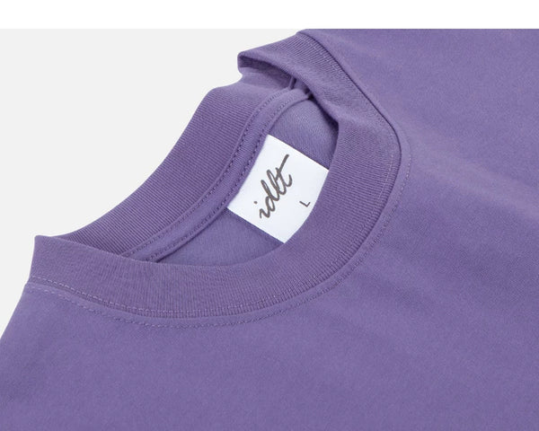 IDLT T-shirt, purple neckline label.