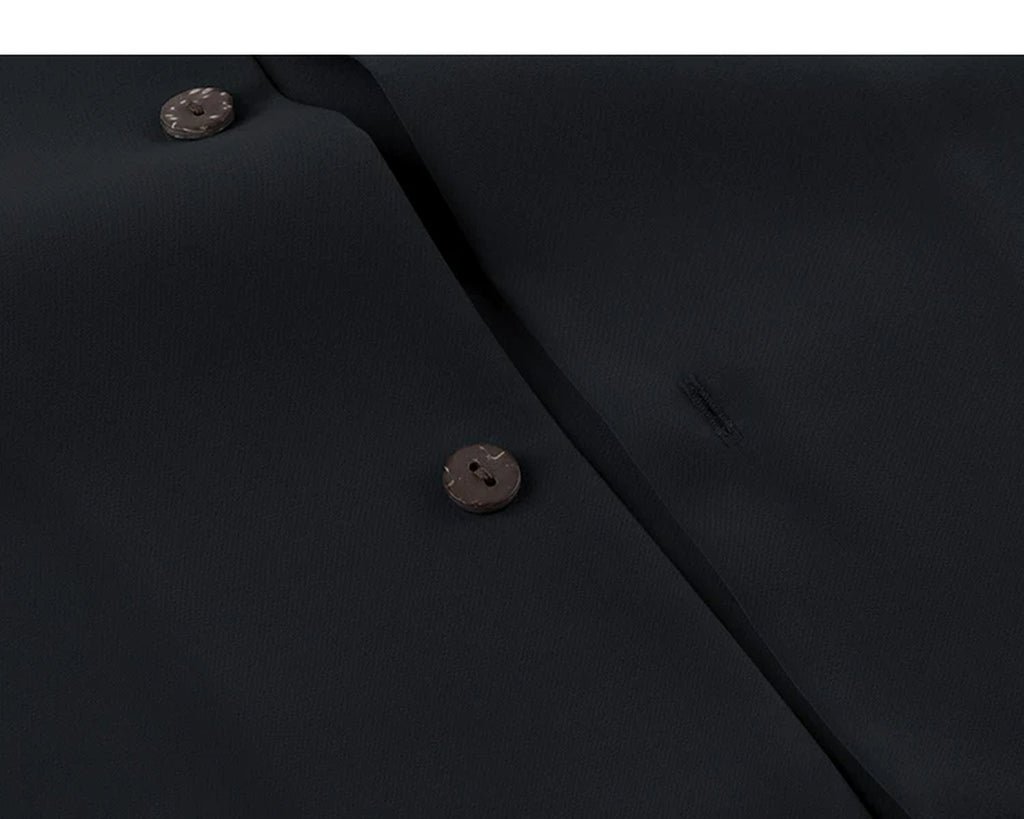 IDLT short sleeve shirt, black buttons close-up.