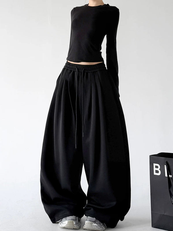 Black front hands view of wide-leg pants