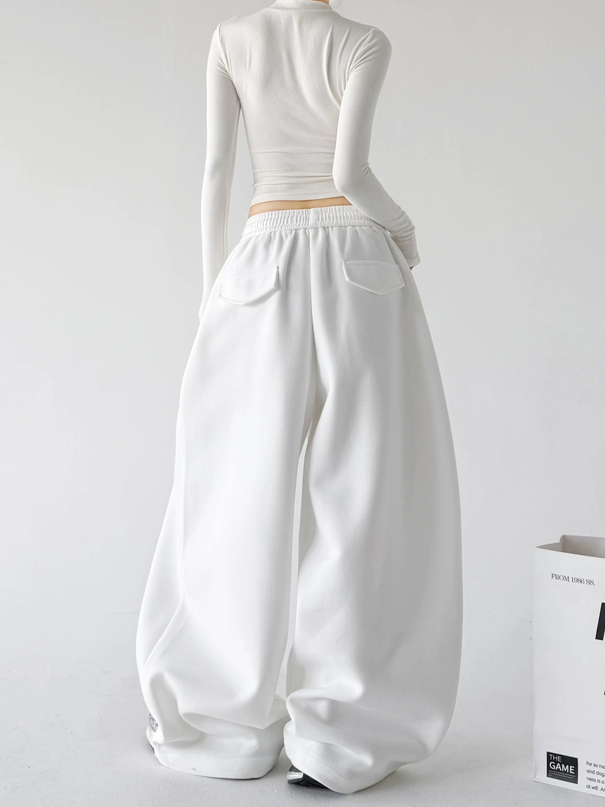 White drawstring wide leg sweatpants, back view