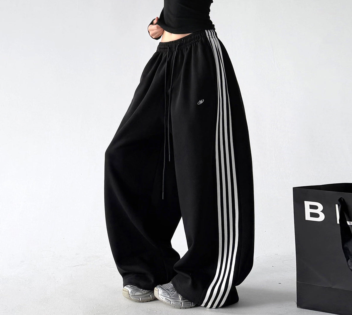 Black side-stripe wide-leg pants side - CT260