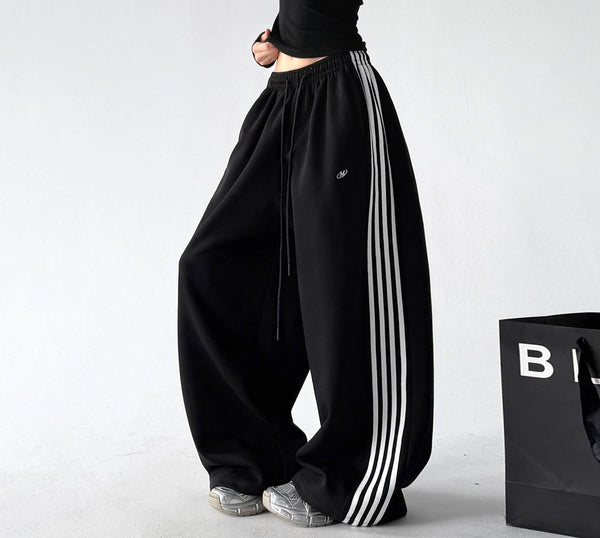 Black side-stripe wide-leg pants side - CT260