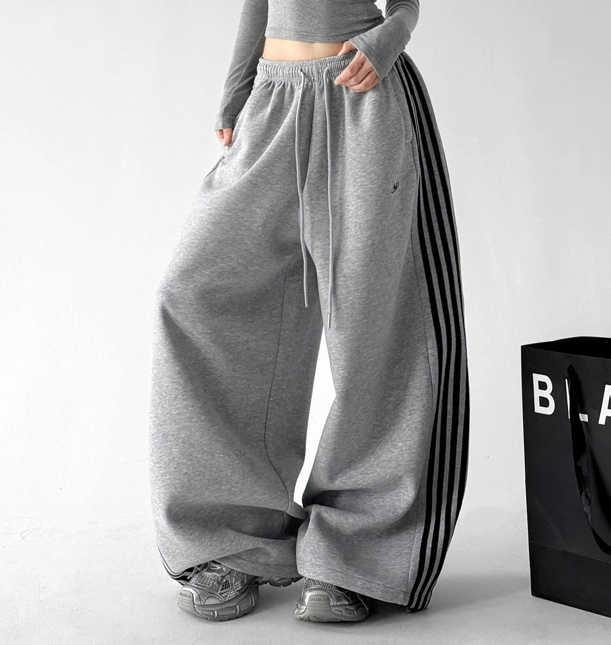 Gray side-stripe wide-leg pants angled front - CT260