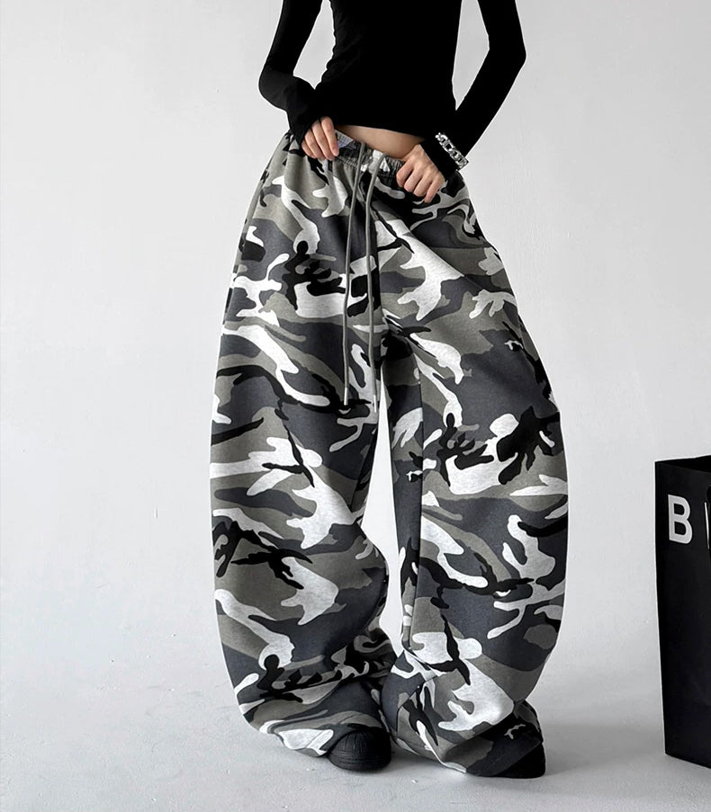 Gray wide leg pants, front hands view