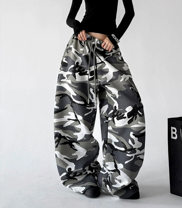 Gray wide leg pants, front hands view