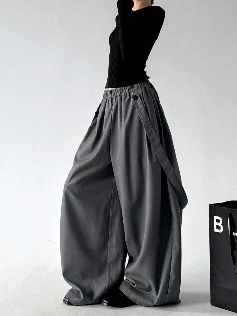 Gray strap detail wide leg pants, angled front view