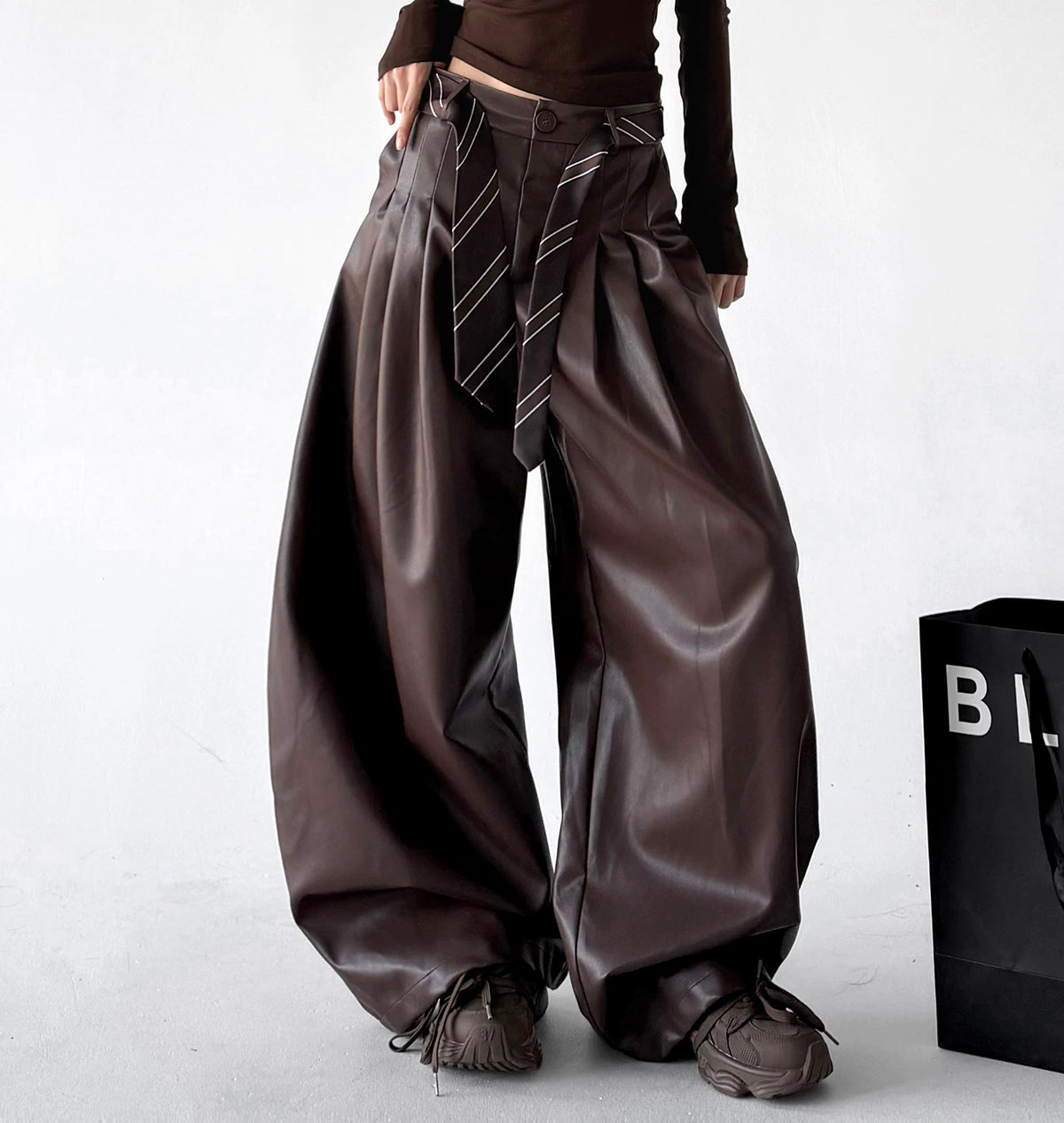 Brown wide-leg PU pants angled front view - CT6267