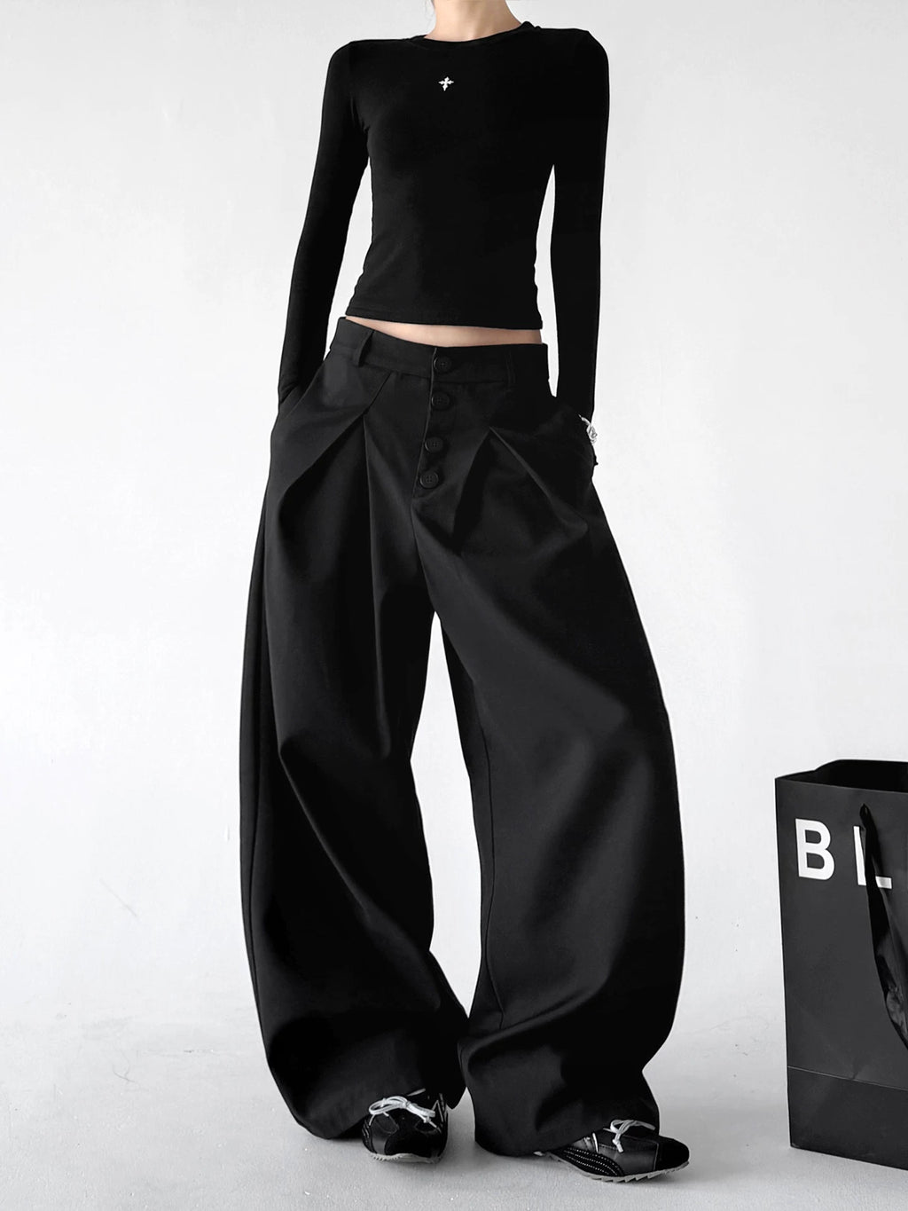 Black wide-leg pants, angled front view