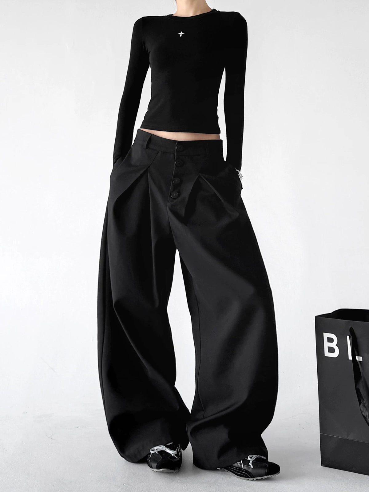 Black wide-leg pants, angled front view