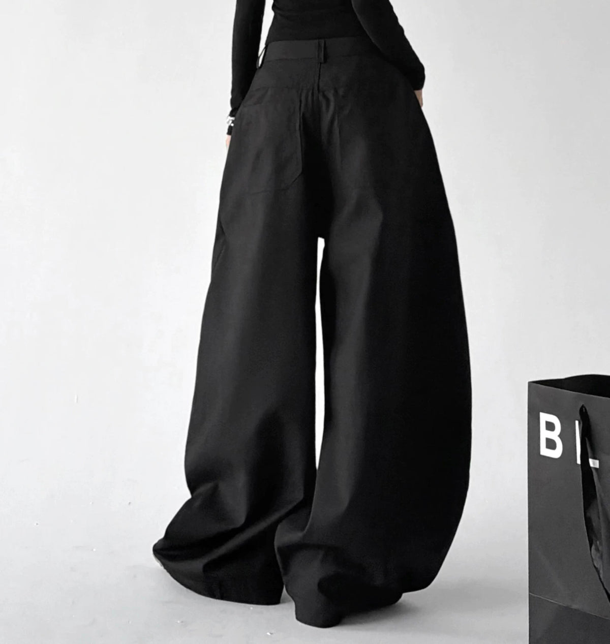 Black star-studded wide-leg trousers back view - CT6277