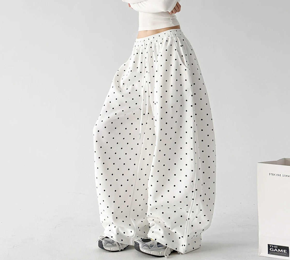 White wide leg pants, angled front view