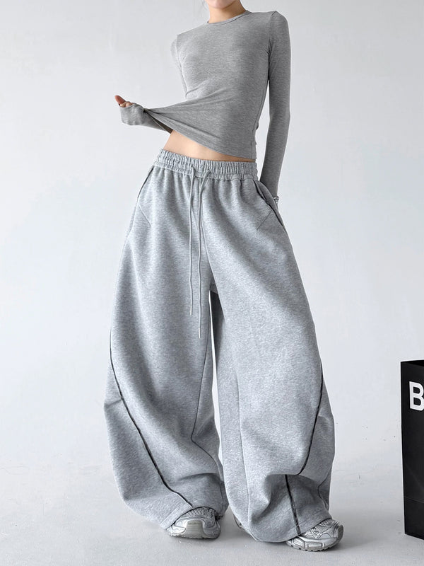 Gray wide-leg pants, front styling view.