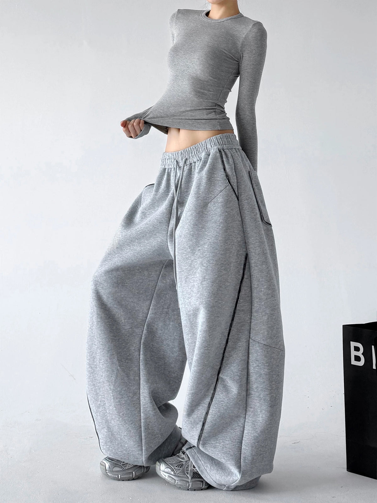Gray wide-leg pants, angled front view.