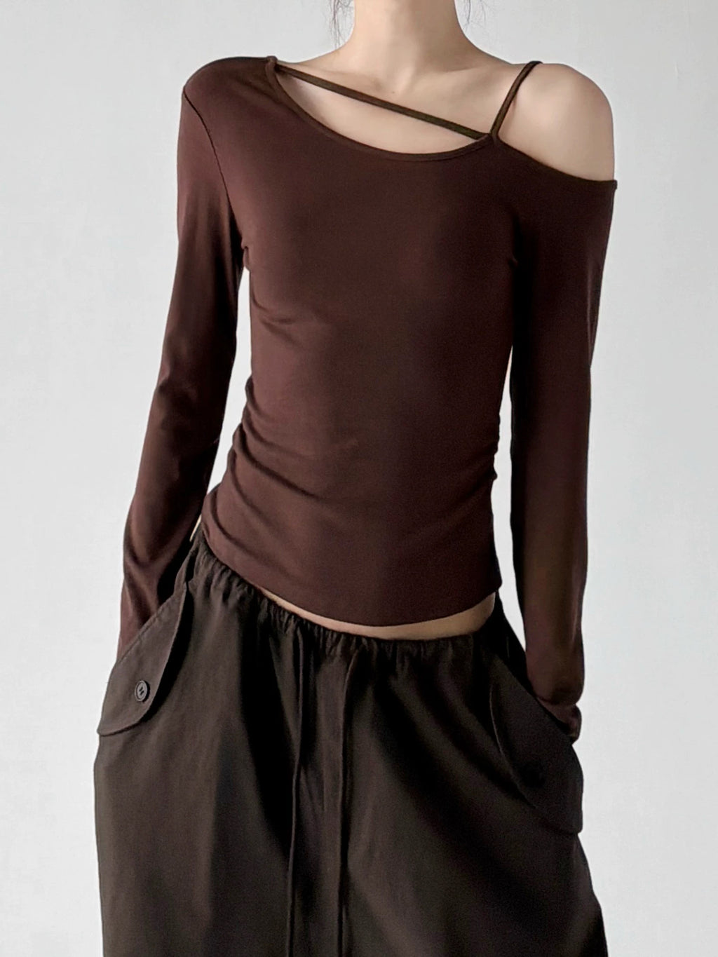 Brown cross strap asymmetric top, front view