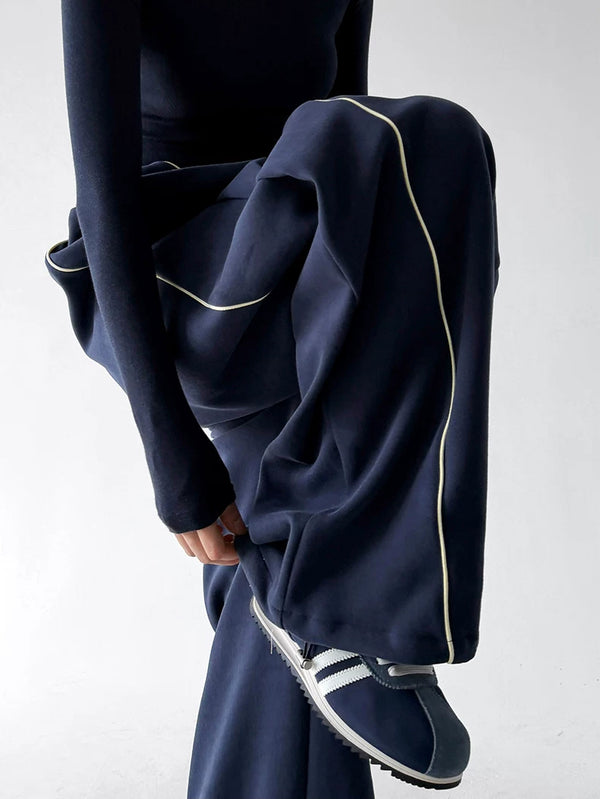 Navy pants, raised leg detail view