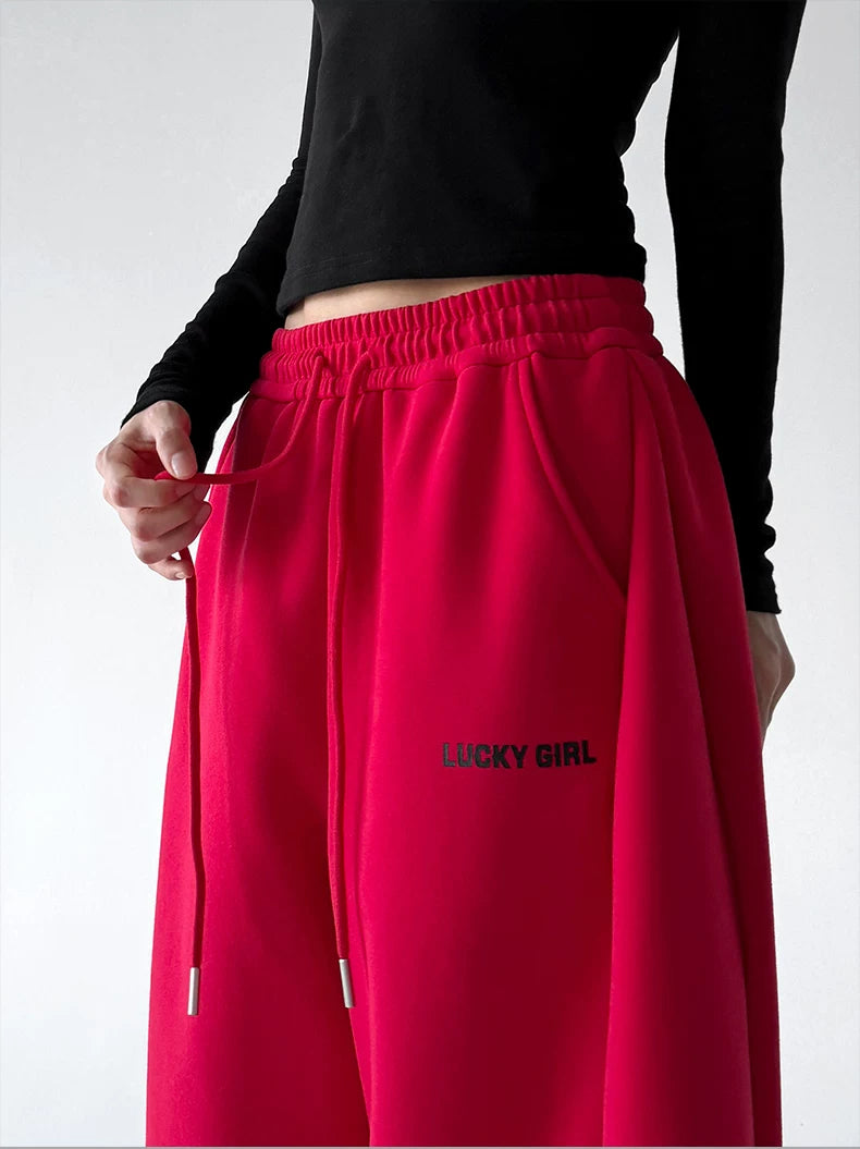 Red waist detail view of wide-leg pants