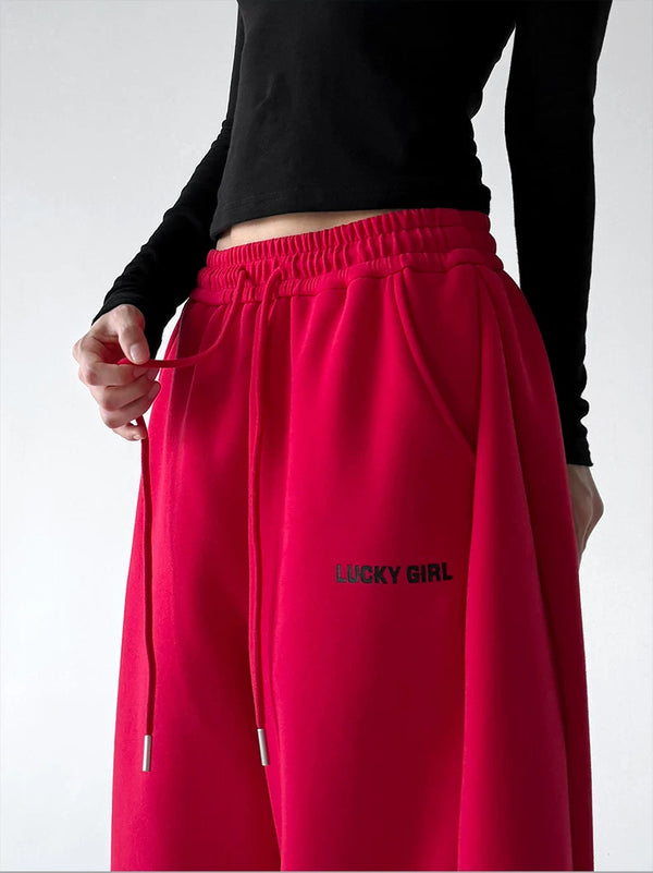 Red waist detail view of wide-leg pants